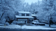 Ons huis in de sneeuw